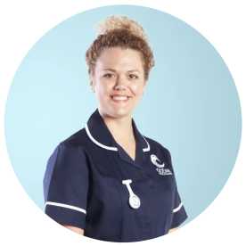Smiling nurse in Ocean Healthcare uniform.