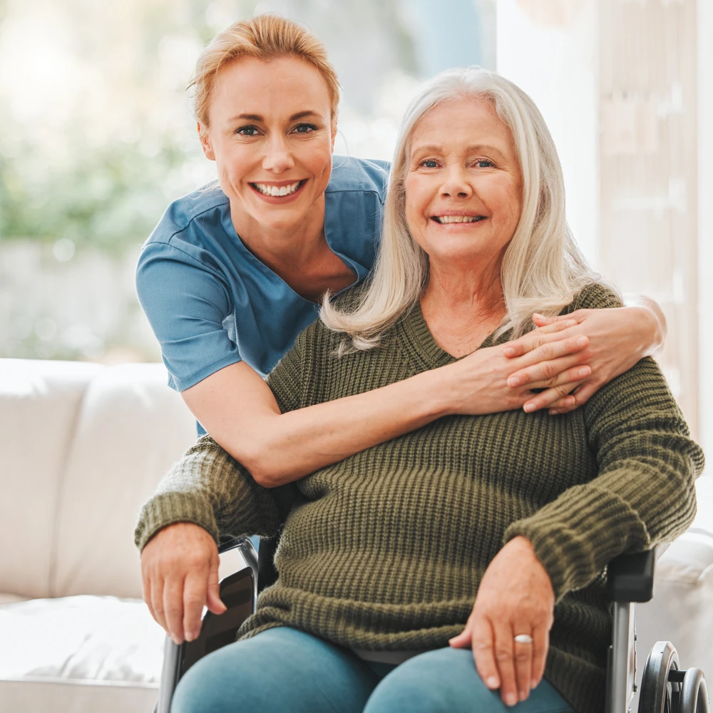 Female Nurse hugging her Mature Patient OHC